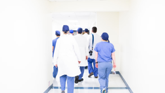 Group of doctors walking on a hospital hallway