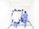 Group of doctors walking on a hospital hallway